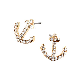 Starfish stud earrings with multicolor crystals on white plate with gold rim