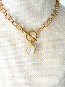 Gold chain choker necklace with toggle closure and large crystal pendant