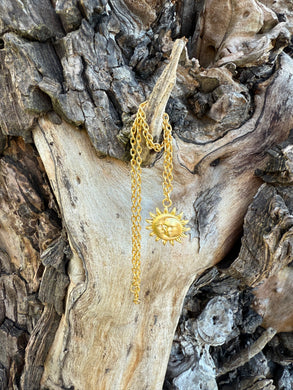 Gold-plated necklace with a sun face pendant on a chain necklace
