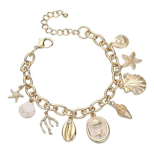 Gold charm bracelet with starfish, shells, coral and ocean motifs